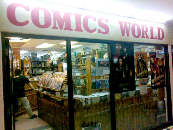 Uncle Bill standing amongst the rows of comics at Comics World